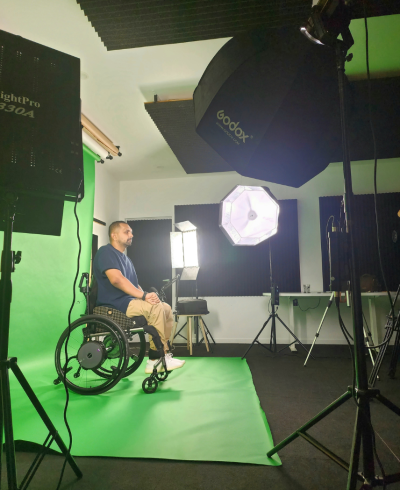 Dinesh Palipana in a wheel chair doing a shoot